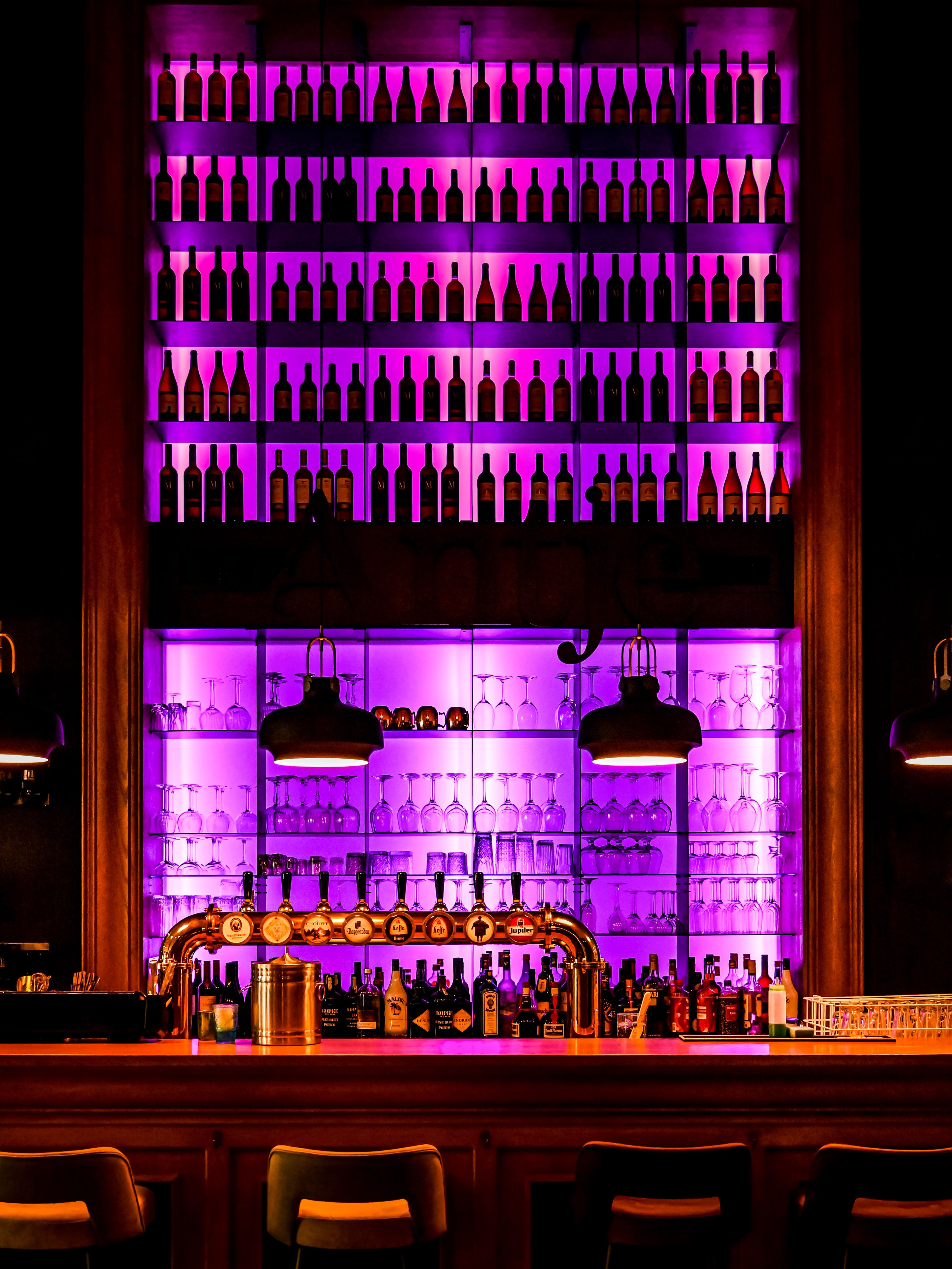 Bar top with shelves of bottles